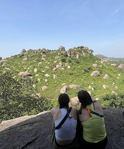 Rachel and friend looking over hill