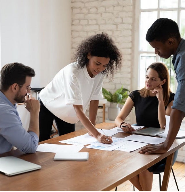 Four people analyzing data