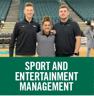 Students posing on a basketball court