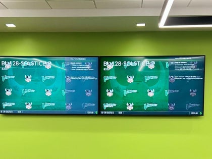 Screens in Viking Trading Lab with CSU logo